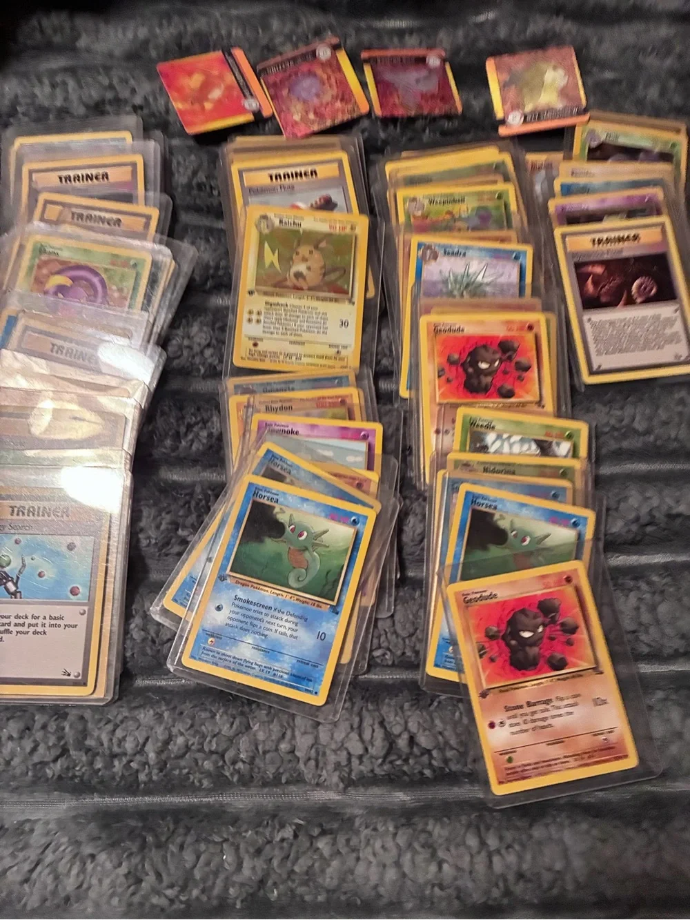 Pokemon Trading Card Lot - Assorted Colors 1997-98 trading cards in plastic hold